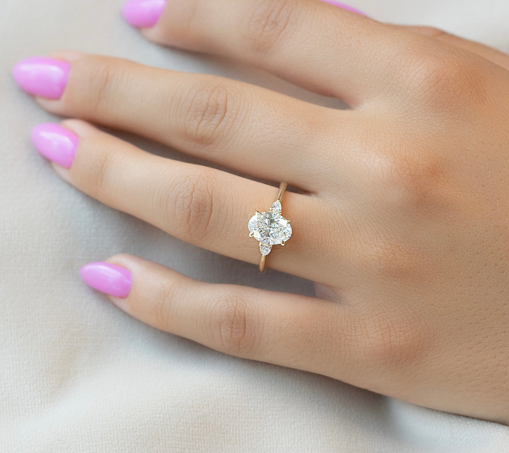 Triple the Sparkle: Three Stone Oval Engagement Rings That Steal the Show
